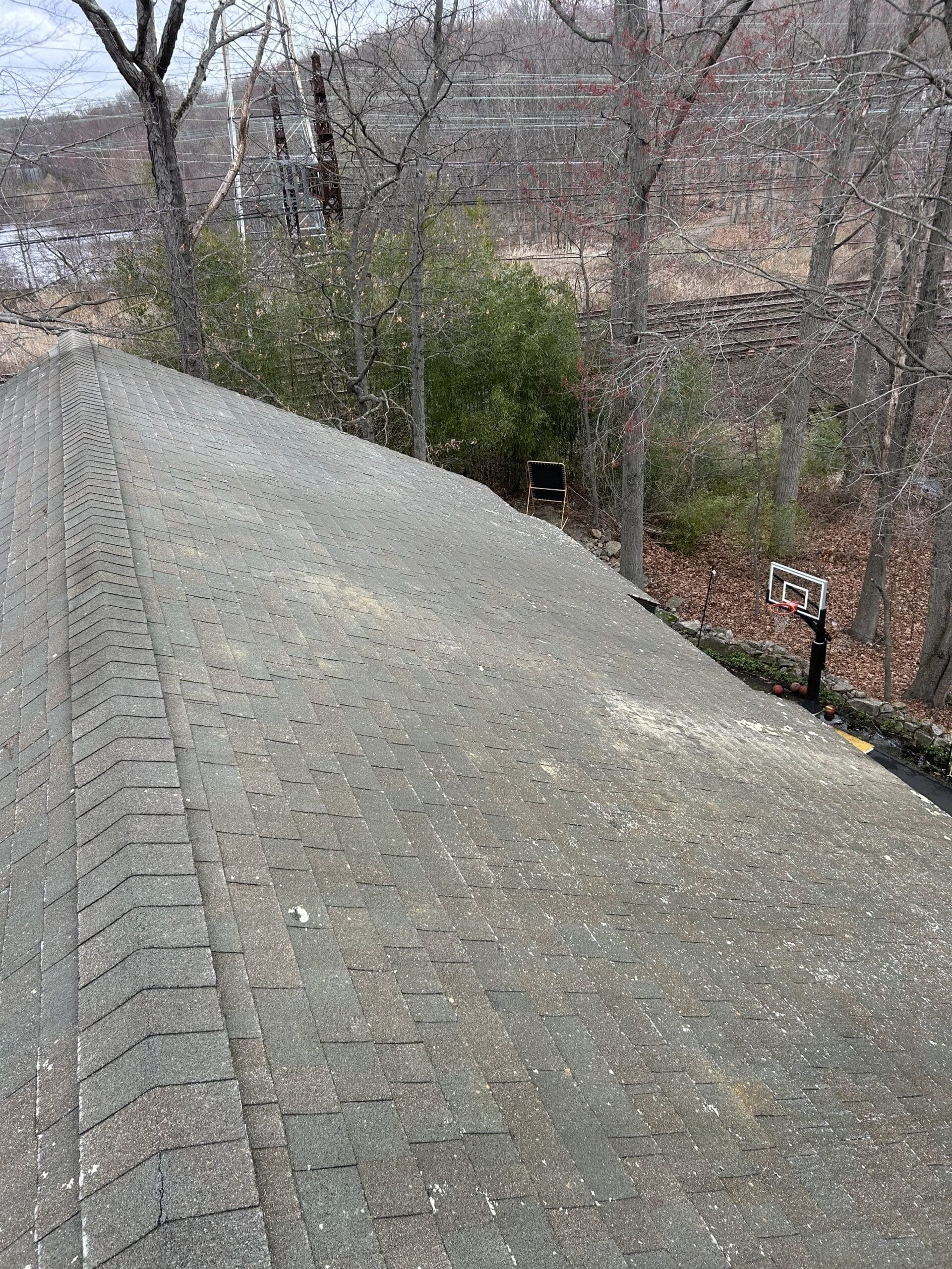 Asphalt roof shingles after soft washing in Westport, CT